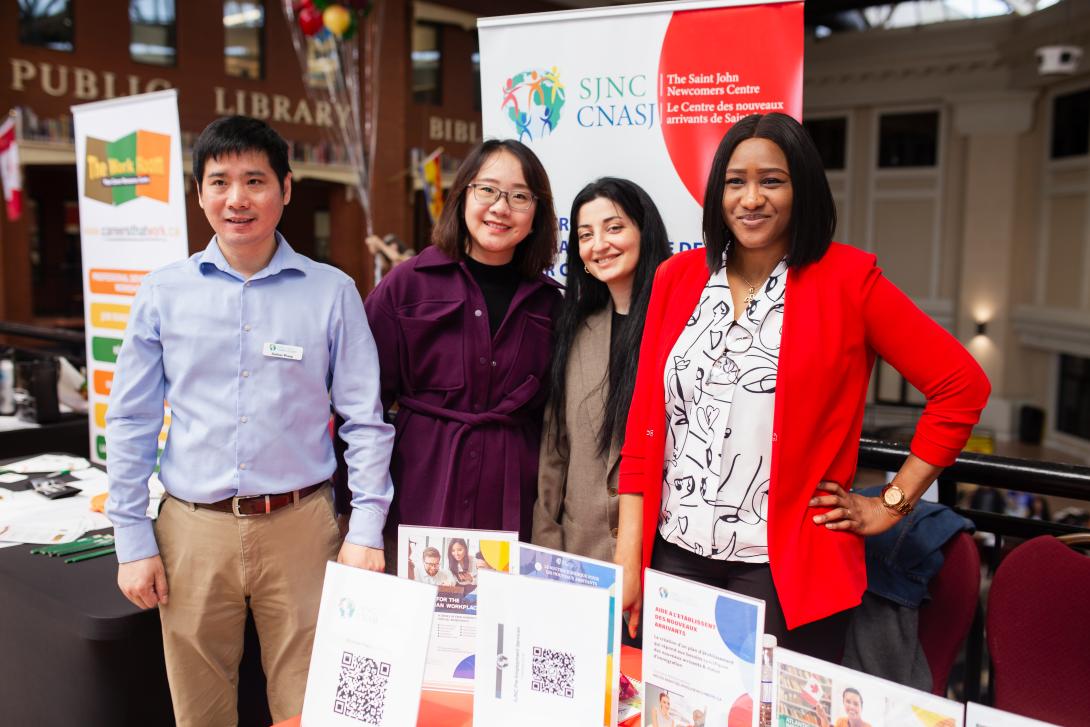 People standing together at a booth