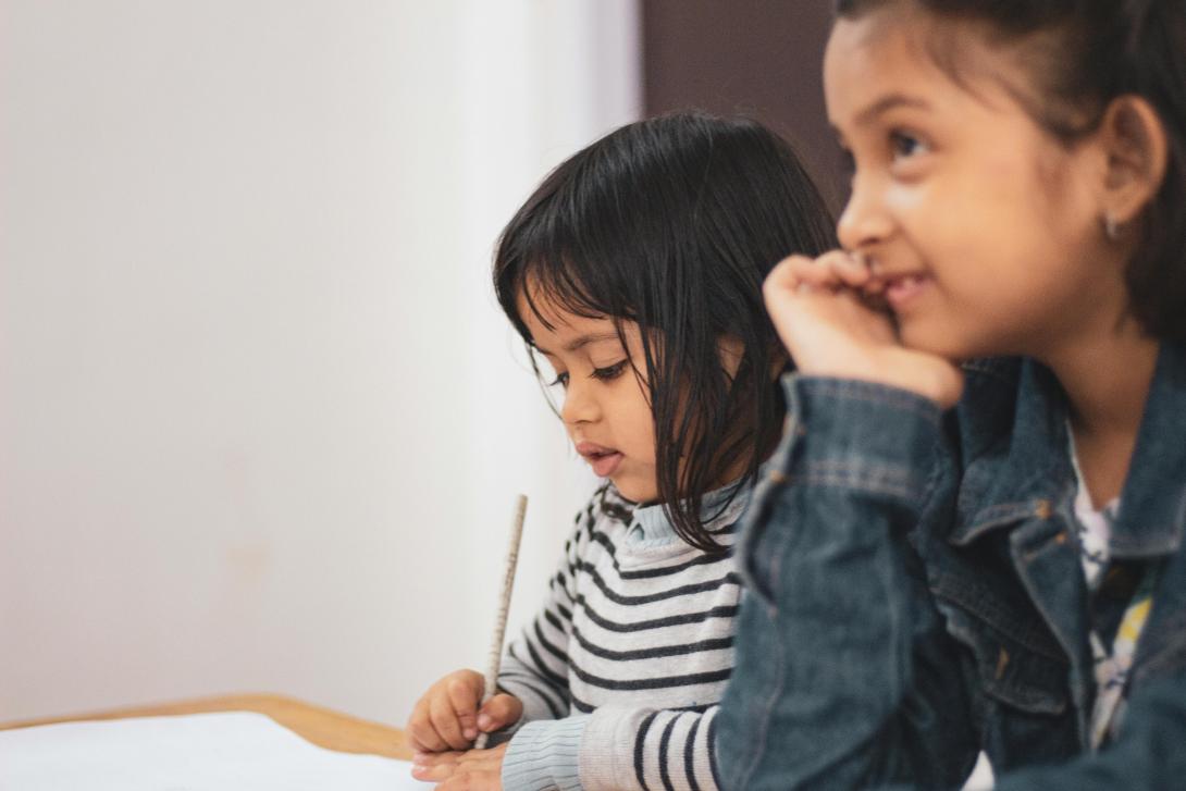 Two kids studying at desk